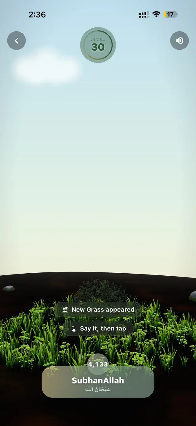 The SubhanAllah garden by day, with grass growing around the tree and a prompt that new grass has appeared